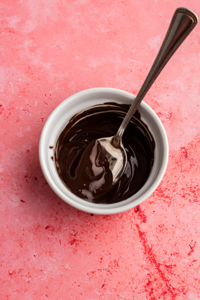 Melted chocolate in a ramekin.