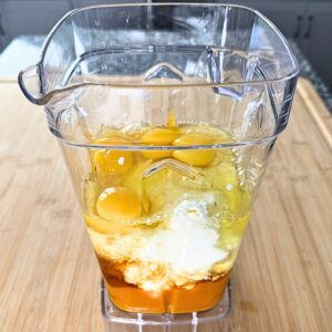 Pumpkin puree, cottage cheese, maple syrup and eggs in blender.