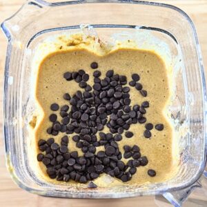 Mini chocolate chips in pumpkin cottage cheese muffin batter.