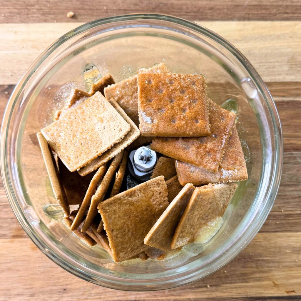 Graham crackers, sugar and melted butter in food processor.