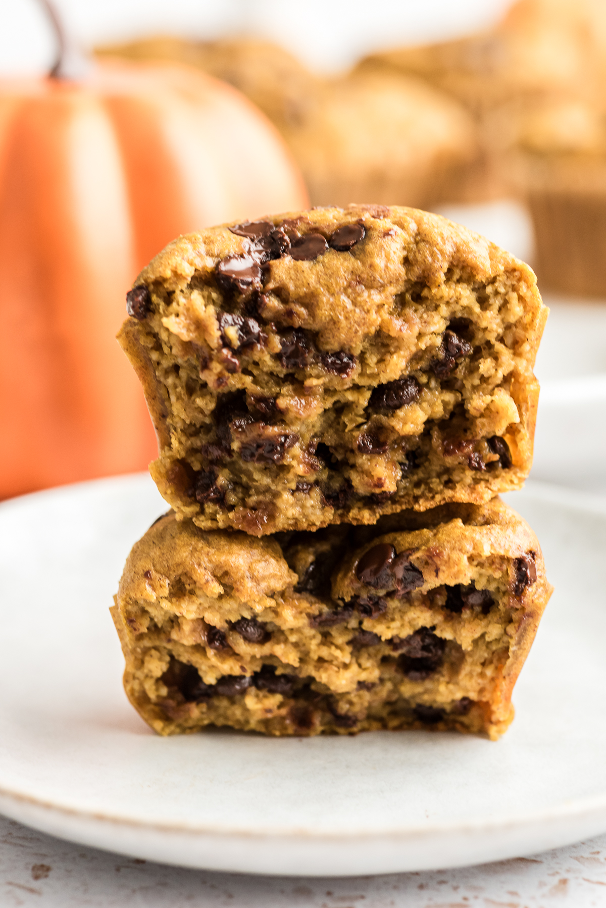 Pumpkin oat protein muffin cut in half and stacked.