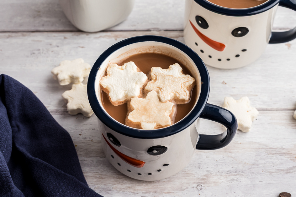 Mug filled with hot chocolate, star marshmallows on top. 
