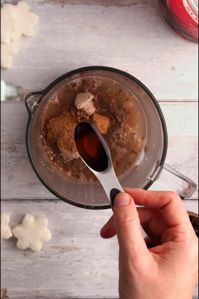 Maple syrup in a measuring spoon.