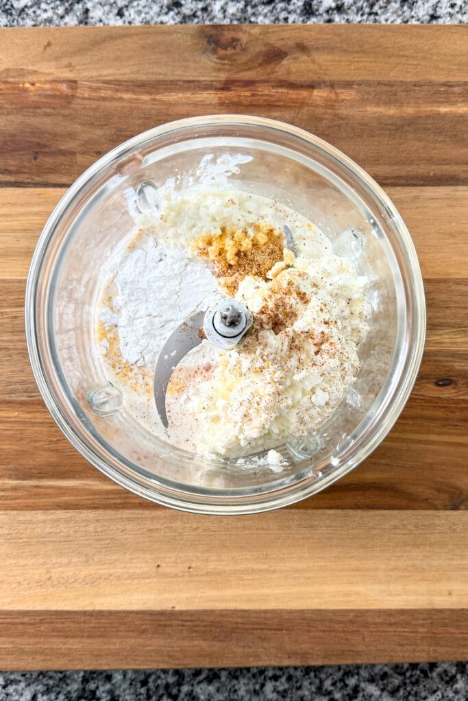 Cottage cheese sauce ingredients in a food processor before blending.