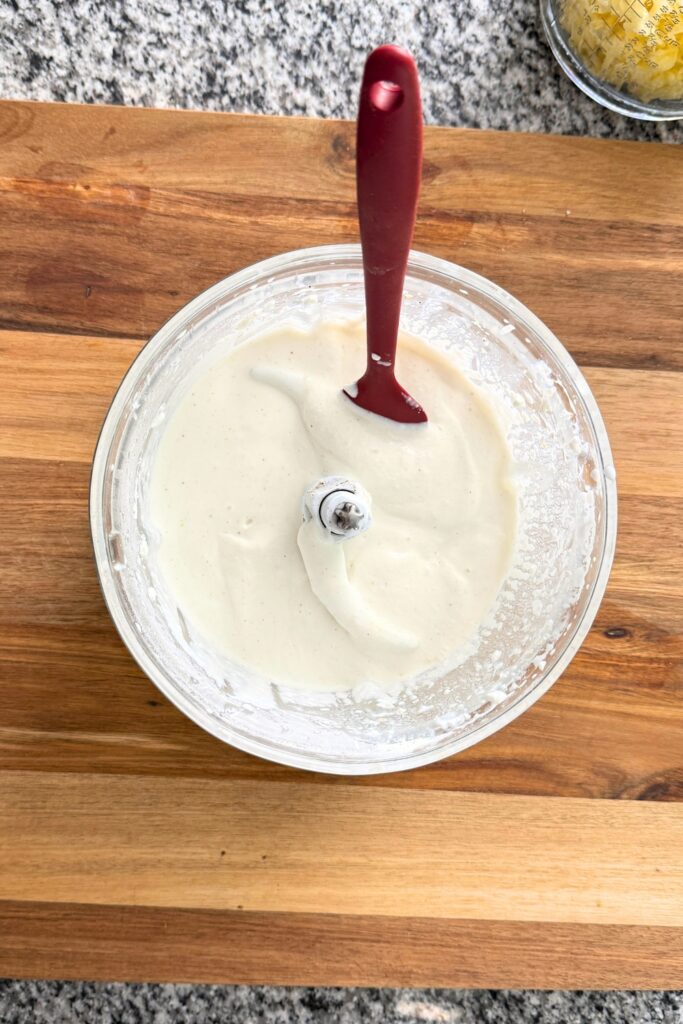 Cottage cheese sauce in food processor after blending.